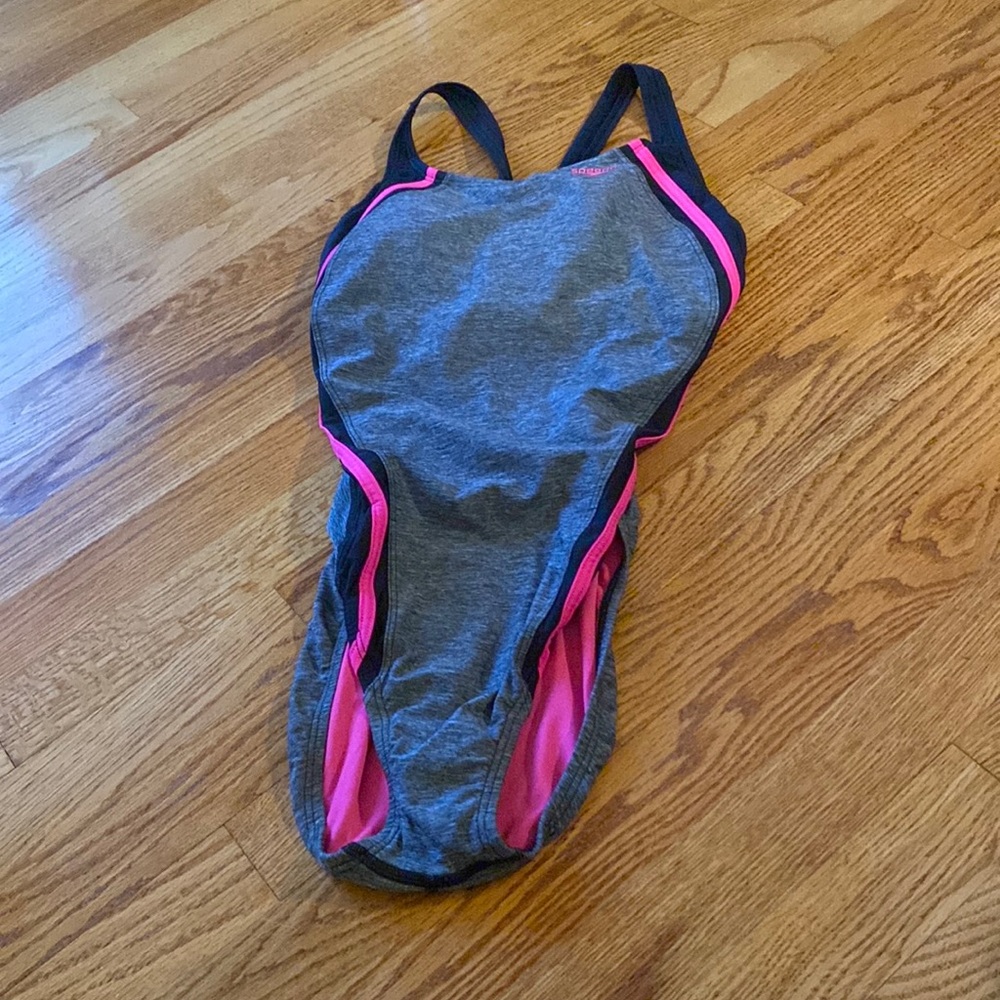 Size 12 Speedo bathing suit with pink and black stripes.